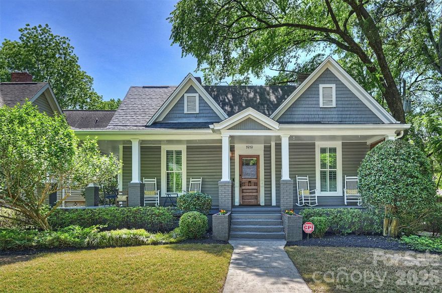 1919 Springdale is a charming Dilworth bungalow that blends classic character with exceptional space and flexibility. The home was thoughtfully expanded with a significant addition completed in 2018.  With 6 bedrooms—including two primary suites—this home offers a rare opportunity to accommodate a variety of living needs, from multigenerational living to guest space or work-from-home setups. Inside, warm and inviting living areas are seamlessly connected, creating an easy, modern flow. The centrally located kitchen opens to both dining and living spaces, making it ideal for everyday living and entertaining alike.  Both primary bedrooms provide comfort and privacy, each featuring ample space, large closets, and well-appointed bathrooms. Additional bedrooms are generously sized and versatile—ideal for guest rooms, offices, or fitness space. Upstairs includes two bedrooms, a spacious bathroom, loft area, and an oversized walk-in storage room.  Outdoor living is just as inviting, starting with the classic wrap-around front porch that immediately welcomes you home. The backyard features a stone paver patio, dedicated grilling.lounge area, and green space for relaxing or entertaining. A detached two-car garage adds convenience and valuable storage—an uncommon feature in Dilworth.  Located just minutes from South End, Uptown, parks, and local dining, this home offers the charm of a historic neighborhood with the space and functionality today’s buyers are looking for.
