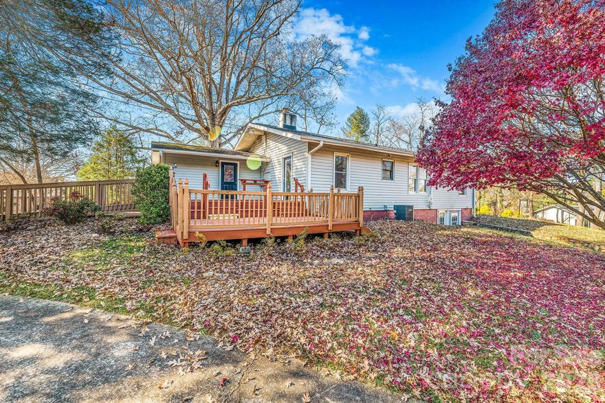 Welcome to a beautifully updated 1930s home where timeless charm meets modern comfort. Set on almost an acre of flat, fully usable land, this property offers the peace and privacy homeowners crave — framed by gentle mountain views and the shade of a magnificent 150 year old white oak.

Step inside to a bright, inviting interior featuring a finished sunroom that floods the home with natural light and adds flexible year-round living space. Outdoors, two decks create the perfect backdrop for entertaining, morning coffee, or quiet evenings under the stars. The .99 acre lot is ready for gardening, pets, or family fun. 

Animal lovers will appreciate the thoughtfully designed two catios, offering safe outdoor freedom for pets — and if you're looking for a turnkey income opportunity, this property delivers. Attached to the home is a bedroom / bathroom that could easily be used as a revenue stream or seamlessly reintegrated into the main residence for additional living area.

Major 2020 updates ensure peace of mind for years to come, including:
• New roof, gutters, and downspouts
• Updated electrical (partial)
• New plumbing and sewage lines
• New water heater
• New AC system with ductwork
• Pellet stove
• Radon mitigation system
• All stainless steel appliances.

Whether you’re seeking a charming retreat, a property with built-in income potential, or a home that blends character with convenience, this one checks every box. Just 10 minutes to Waynesville and 30 minutes to Asheville — the perfect balance of privacy and accessibility.