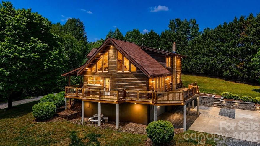 Nestled on 6.78 private acres, this charming 1996 log home offers the perfect blend of rustic character and comfortable living. Featuring three bedrooms and two full bathrooms, the home showcases a stunning two-story great room with cathedral ceilings, creating an open and inviting atmosphere. Warm all-wood flooring runs throughout, complemented by a cozy fireplace and wood-burning stove for added charm. The full basement includes a double garage, while an additional detached double garage provides ample storage and workspace. Enjoy peaceful surroundings and ultimate privacy in this beautiful countryside retreat.