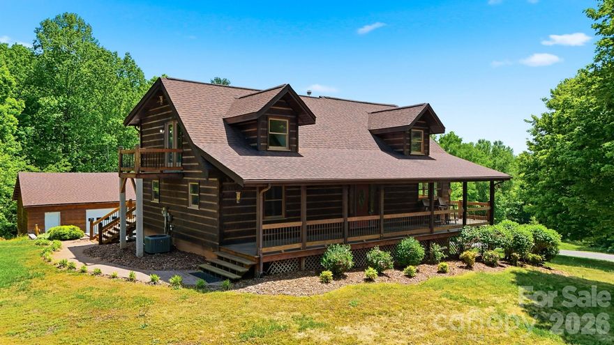 Nestled on 6.78 private acres, this charming 1996 log home offers the perfect blend of rustic character and comfortable living. Featuring three bedrooms and two full bathrooms, the home showcases a stunning two-story great room with cathedral ceilings, creating an open and inviting atmosphere. Warm all-wood flooring runs throughout, complemented by a cozy fireplace and wood-burning stove for added charm. The full basement includes a double garage, while an additional detached double garage provides ample storage and workspace. Enjoy peaceful surroundings and ultimate privacy in this beautiful countryside retreat.
