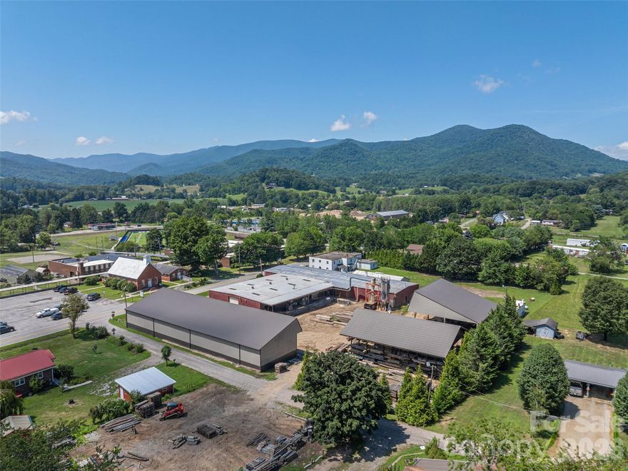 A rare find in Bethel, NC! This exceptional mixed-use/industrial property combines small-town charm with big-business potential. Featuring 1,800 SF of finished office/retail space, a 15,830 SF industrial building, and 12,460 SF of covered storage, it’s one of the few turn-key warehousing or factory opportunities in the county. Built to impress, the industrial facility offers heavy three-phase power, updated electrical, 2 loading docks, 5 oversized roll-up doors, upgraded LED lighting, and a hard-piped compressed air system. The private office building includes 8 individual offices, a large conference room, and a fresh new HVAC system. What truly sets this property apart are the 3 onsite apartments—two 1BR/1BA suites and a 3BR/1BA unit—perfect for additional income or housing staff moving to the area. With no zoning restrictions, this property offers endless potential for those ready to bring their business dreams to life in a growing
mountain community. Owner open to partial leaseback.