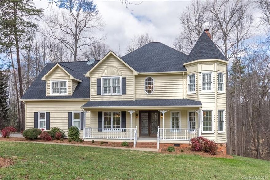 Set on a wooded lot in a quiet neighborhood, this beautiful home has tons of charm, from the covered front and back porches to the detailed mouldings throughout. You'll find rich hardwoods on the first floor, new carpet upstairs and fresh paint throughout. Formal Living and Dining. All bedrooms have walk-in closets. There's a bonus room with a window seat and built-ins with lots of storage. Low SC taxes and the Award-winning Clover School District.