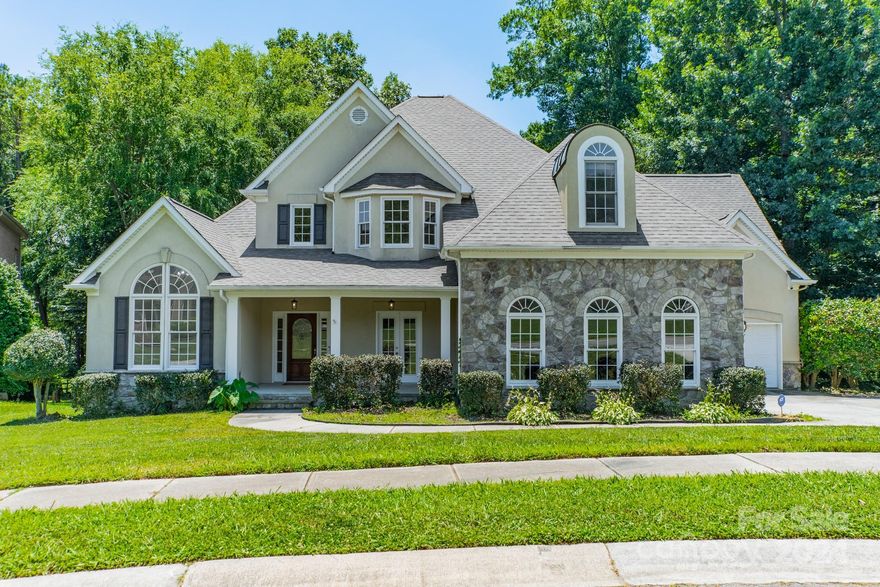 Enjoy breathtaking views of the Highland Creek Golf Club's renowned 17th hole, providing a picturesque backdrop for relaxation and recreation. Boasting 3857 square feet of exquisitely designed living space. Upon arrival, you're greeted by a grand facade that hints at the luxury within. Step through the impressive entryway and into the expansive foyer with gleaming hardwood floors. Entertain with ease in the spacious living areas, including a formal dining room perfect for hosting elegant dinner parties. Unwind in the lavish main floor primary suite, complete a spa-like ensuite bathroom featuring a luxurious jacuzzi tub.  Luxury living awaits with a see-through fireplace, seamlessly connecting the family room to the adjacent office space. Four additional bedrooms offer comfort and privacy for family members or guests. Step outside to discover your own private paradise, where a sparkling pool awaits on hot summer days, surrounded by a spacious patio ideal for outdoor entertaining.