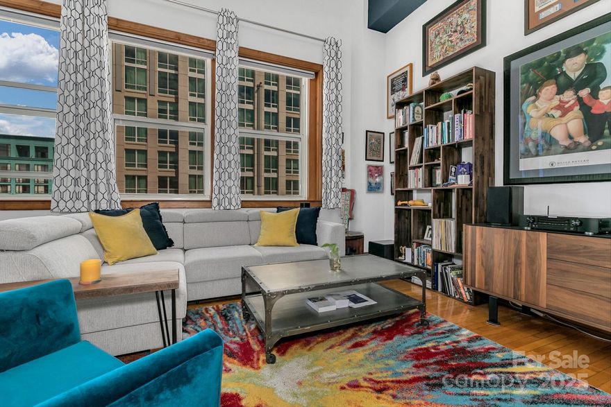 Step out your door into the heart of downtown Asheville! This sunlit condominium puts you within close reach to all that Asheville has to offer, from the waterfalls and mountain views and hiking/biking choices, or the myriad music and dancing events, to the numerous award-winning culinary options. Located in the highly coveted Kress Building, the modern updates to this condominium will have you feeling right at home four stories above the action. With a wall of windows and ceilings over twelve feet, the sunlight truly fills up the space of this unit. The rooftop flex space is a great spot to work remotely, or you can just relax and take in the sunshine or sunset on the terrace. The property includes an easily accessible 10 x 10 storage unit in the basement. Making things even easier for a new buyer, the seller is willing to sell the property furnished! Asheville has become one of the nation's most popular cities to visit and here is your opportunity to get in on the excitement. It may be too late to get in on the ground floor, but the fourth is still available for a limited time!