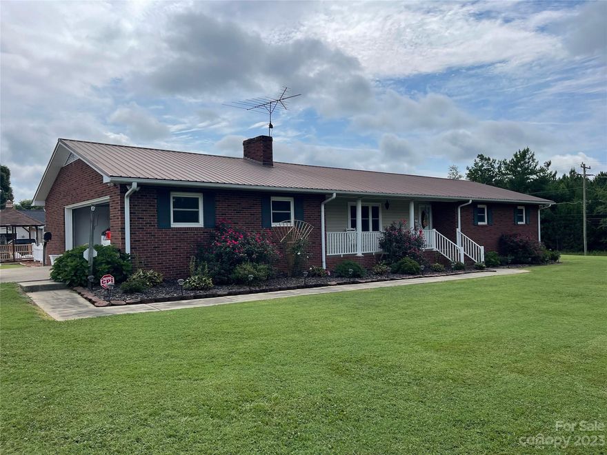 NEW IMPROVED PRICE! WELCOME HOME!!! Brick ranch with basement. This home is larger than looks from the road. It has 2300 square feet on main level and 1700 square feet in the basement.  There are three bedrooms and two baths on the main floor. There is a large laundry/mud room off garage entrance. There is a bright kitchen with an island, lots of cabinets, and all kitchen stainless appliances convey. The large living room has gas fireplace. The dining room has plenty of room for a big table. The heated and cooled sunroom gives another living space and is gorgeous! Don't forget the basement has a half bath, separate rooms for an office space, game room and more. Propane used for heater for basement, heater in laundry room and gas logs in living room.  Outside there is a 23x25 metal building/garage/ shop, extra concrete for extra parking, and an in-ground swimming pool with gazebo. All this is on a corner lot that measures .88 acres.  Not in city limits. Motivated Seller.