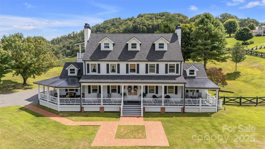 Perched above the New River with sweeping mountain and river views, this Colonial home combines timeless charm with thoughtful modern updates. A welcoming front porch with Chippendale railings sets the tone for multiple Trex-decked porches for relaxing or entertaining. Inside, the showpiece kitchen showcases a Country French design that balances rustic warmth with refined elegance, complemented by a butler’s pantry and oversized laundry room for added function and style. Natural light fills the main level sunroom, which opens to a fenced backyard retreat, while tongue-and-groove ceilings and updated finishes add character throughout. Upstairs offers three bedrooms and two full baths, while the third level provides two additional flexible rooms—great for hosting guests, a home office, hobby space, or playroom—along with another full bath, ample storage, and a balcony overlooking the stunning mountain and river landscape. This home blends mountain beauty, river views, and modern convenience—designed for comfortable living and effortless entertaining. Recent improvements include a new roof, new HVAC, LP Smartboard siding with board-and-batten details, fenced yard, a designer dog wash with pot filler, new Kohler toilet in guest bathroom upstairs, new thermostat in bonus room, new lighting upstairs, and much more! See complete list in attachments.