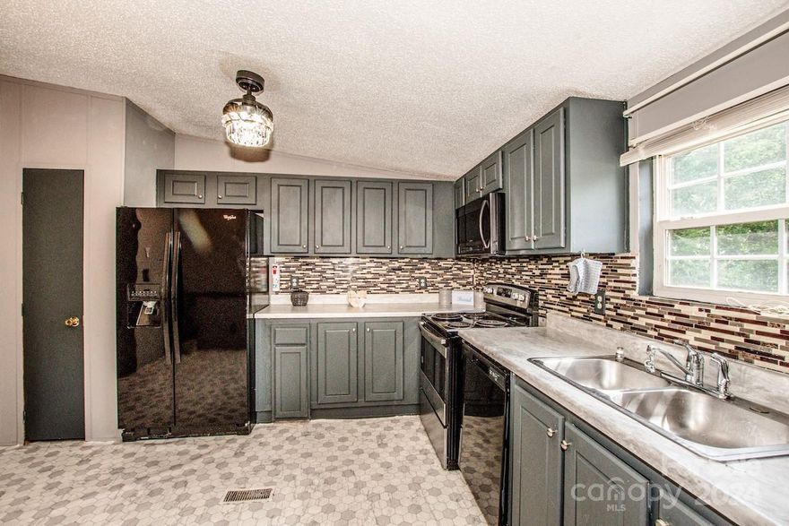 Welcome to your new dream home! This spacious 3-bedroom, 2-bath  home offers the perfect blend of comfort, convenience, and tranquility. Nestled on a generous .69-acre lot, you'll find yourself surrounded by the serenity of nature while being just a stone's throw away from all the local amenities you could wish for, including vibrant shopping centers and an array of delightful restaurants. As you step inside, you're greeted by a warm and inviting living space, complete with plenty of natural light and ample room for relaxation and entertainment.  Outside, the expansive yard provides a peaceful retreat where you can enjoy outdoor activities, set up a garden, or simply relax under the vast, open sky. Don’t miss out on the opportunity to make this lovely house your new home. It's perfect for anyone seeking a blend of peaceful living and convenient access to city amenities!