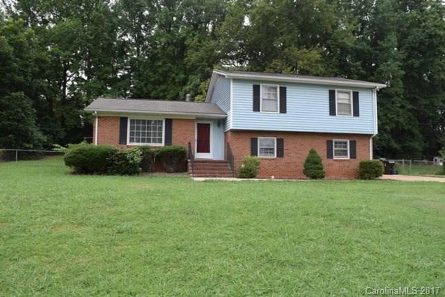 Great home w/ beautiful yard makes for a DIY'ers dream.  This tri-level home is situated on a large lot in a well established neighborhood. Spacious living room and kitchen on the main level.  Home offers so much living space. Large great room on lower level with wood burning stove/FP. The back deck is great place to unwind with a cup of tea!  Needs just a touch of TLC. Some repairs were made on the lower level of the house.  Please note that the work is guaranteed for three years.