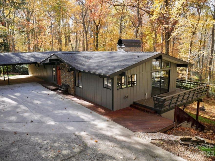 This peaceful and stunning home has been freshly renovated, providing a modern touch.  The one acre lot is less than 5 minutes to Main Street and the Brevard Racquetball Club, and also just 10 minutes to the Pisgah Forest Ranger Station, making accessibility to the mountains,rivers, and entertainment a breeze.  The modern layout is perfect for entertaining, featuring a modern smart-appliance kitchen, spacious bar area, and open living areas with two original river-stone fireplaces and large wrap-around decking.  The matching stone walls outside and landscape truly make this property feel like you’ve escaped into the mountains, while still being close enough to enjoy all the community benefits Brevard has to offer!  First floor living with picture frame windows, sliding doors, and vaulted ceilings creates stunning natural lighting, adding to the desirability of this home.  Every season is a true treat. Photos can’t do justice to the beauty of this home, come see for yourself!