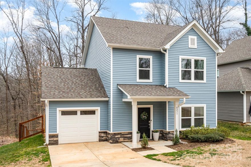 This absolutely beautiful home sits so close to Charlotte it is hard to pick the best feature, location or style! The open floor plan downstairs is exactly what you have been looking for! Builder details are obvious and well done in this just-like-new house. The laundry room doubles as storage and drop zone and hides neatly behind a pocket door. The bedrooms are all upstairs and very generously sized. The main bed and bath create privacy from anything or anyone with a large bedroom, dual vanity sink, and walk-in closet. But the true gem of this home is the backyard! The large lot allows plenty of space for dogs, kids, or owners to run and play. This large lot allows for a great fenced in back yard with a peaceful atmosphere. The wooded area behind the home creates a peaceful atmosphere.  The newly constructed patio is a great place to decompress from a long day, whether your office is the very short 15 minute drive to Uptown Charlotte, or just inside this beautiful home.