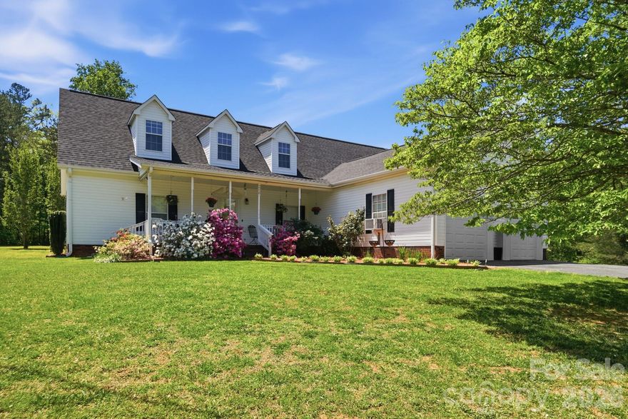 Enjoy the freedom of country living on just under 4 private acres with no HOA and no restrictions—perfect for those seeking space, flexibility, and endless possibilities. This well-maintained modular home, built in 2002, offers a desirable split-bedroom floor plan with 10-ft ceilings and a layout designed for both comfort and functionality.

The spacious primary suite features a large bedroom and an ensuite bath complete with a garden tub, walk-in shower, and dual vanities. The kitchen is open and inviting, featuring a butcher block center island, electric flat-top range, and vent hood, which provide ample space for cooking and gathering. The home also includes a dedicated dining area and living room, creating a natural flow for everyday living and entertaining.

Step outside to enjoy the covered front porch or relax on the rear deck overlooking a fenced yard, ideal for pets, gardening, or outdoor enjoyment.

The second floor offers a finished bonus room plus an additional 1104 Square Feet of unfinished space, presenting incredible potential for expansion—whether you envision a media room, additional bedrooms, home office, or flex space.

This property truly stands out with its attached 2-car garage plus a detached 672 sq ft garage/workshop equipped with electricity and water—perfect for hobbies, storage, equipment, or a home-based business.

Enjoy the benefit of county water for everyday use, along with an existing well that remains on the property, ideal for irrigation, gardening, or outdoor needs. The home is serviced by a septic system, supporting efficient country living.

Additional highlights include:

Roof approximately 2 years old
HVAC approximately 3 years old
Handicap-accessible first floor
Open land suitable for a variety of uses including recreational, agricultural, or business purposes (buyer to verify)

Conveniently located near Crowders Mountain, I-85, and the new Two Kings Casino, offering both privacy and accessibility.

This is a rare opportunity to own a property that combines land, functionality, and flexibility—ideal for buyers looking for more than just a home, but a lifestyle.