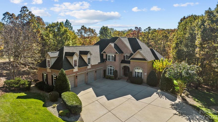 This is the waterfront home you've been waiting for!! Located on a private, 1.77 acre lot with mature landscaping and a private dock, this all brick home features a 4-car attached garage, a circular driveway, a huge screened porch overlooking the lush backyard and mature hardwoods for tons of privacy. The open, bright floorplan features the primary bedroom AND a guest bedroom on the main level, a formal dining room, a home office, a sunny breakfast area, and a beautiful living room with a vaulted ceiling and gas fireplace. The gourmet kitchen features a thermadore gas cooktop, double wall ovens, a large center island and a farm sink. Upstairs you will find two additional bedrooms with walk-in closets, an oversized bonus room with a bar area and a private flex room that could be used as an additional bedroom. Clover Schools and Low Taxes!! Don't let this one get away!