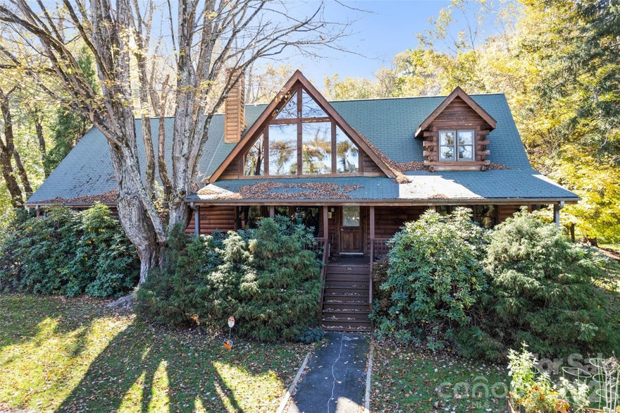 Excellent building and location at the entry of Maggie Valley along Soco Road. The building has potential for a variety of uses. It was originally a model home. It has 2 bedrooms and 2 full baths. Potential for 5 offices and a reception area with a full kitchen. Parking lot and covered deck. Large storage area on upper floor. The interior was remodeled in 2023 to include high end cabinets, luxury tiled shower in primary bath, wood floors in main area.