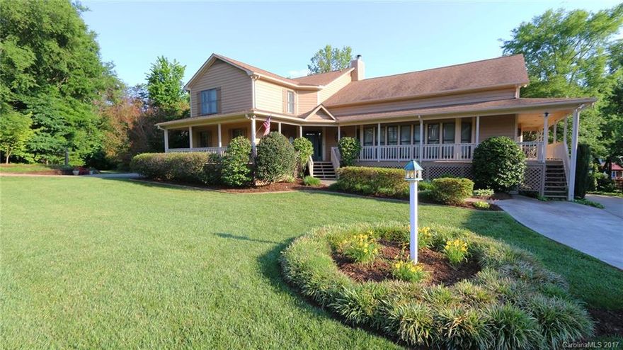 Custom Cedar Home w/Master on Main & NO HOA's! Freshly Painted & Updated! Open Floor Plan w/Wrap-Around Porch w/Spectacular Views. Kitchen w/Granite & Eat-At Bar Area, 2 Story Great Room w/Fireplace & Raised Loft, Huge Master on Main w/Sitting Area & Spa Like Bathroom, Bedroom 2 Has Direct Access to Full Bath, All Secondary Bedrooms are Very Spacious w/Tons of Closet Space, Partially Finished Basement w/Tons of Possibilities, Pier w/Covered Boatslip, Rare Boat Ramp, 3 Car Garage Has 1 Door Bay.