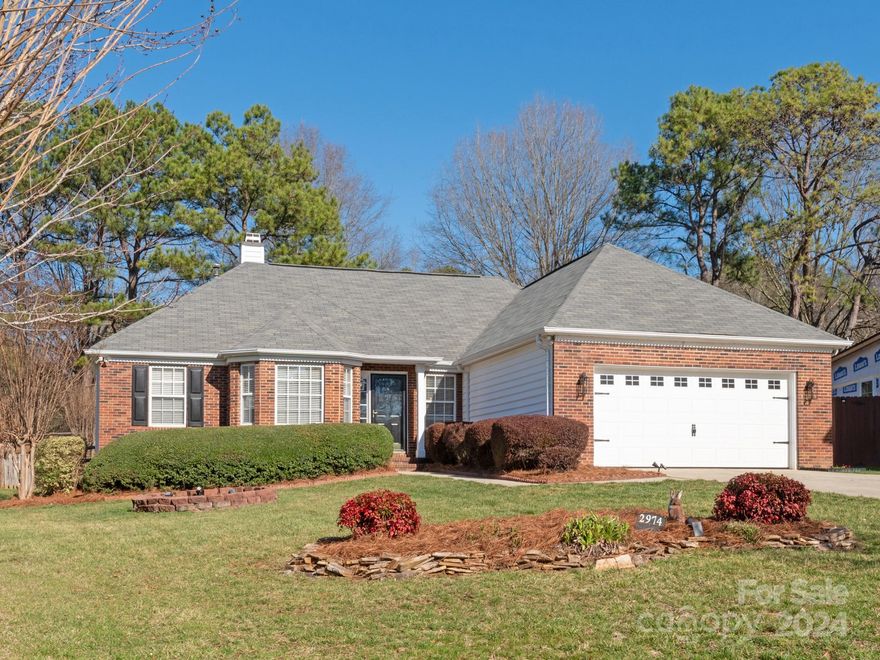 Welcome home to Huckleberry Hill! Step inside this beautiful one story home and be amazed by gorgeous cathedral ceilings, bright/open floorplan with all NEW neutral paint throughout. This 3 bed/2 bath home offers main level living at its finest! Lovely dining room with bay window adjacent to an expansive living room and beautiful kitchen featuring granite, tile backsplash, SS appliances, and under cabinet lighting. Retreat to the spacious primary with a tray ceiling, walk-in closet, and primary bath with double vanity sinks, garden tub, and separate shower. 2 additional bedrooms, full bath, and laundry complete the main living. Enjoy the serene screen porch overlooking the private backyard, custom closet systems, lovely crown molding, newer water heater, inground irrigation, and more!  Don’t miss this beautiful home and amazing neighborhood featuring a community pool, tennis courts, park, walking trails, and conveniently located just minutes away from I-77 and top-rated schools!