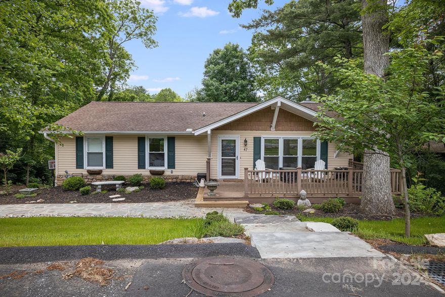Welcome to this inviting 4-bedroom, 3-bathroom residence in the Beverly Hills neighborhood, a 10 minute drive from Downtown Asheville. A spacious kitchen features a breakfast bar and overlooks the main dining space, perfect for entertaining guests. The main-floor primary suite includes a walk-in closet and ensuite bath with a clawfoot tub and standing shower. The fully finished basement has an additional bedroom and full bath, accessible from inside or through a private entrance. The spacious upper and lower decks offer peaceful views of the partially fenced back yard and tree-topped hills of the neighborhood. Recent upgrades by the current owner include whole house water filter, grading and landscaping, built-ins, flooring, soundproofing, and updated fixtures. A full list of improvements is available upon request.  The community features several small commons areas along with the Asheville Municipal golf course which has recently undergone major renovations.