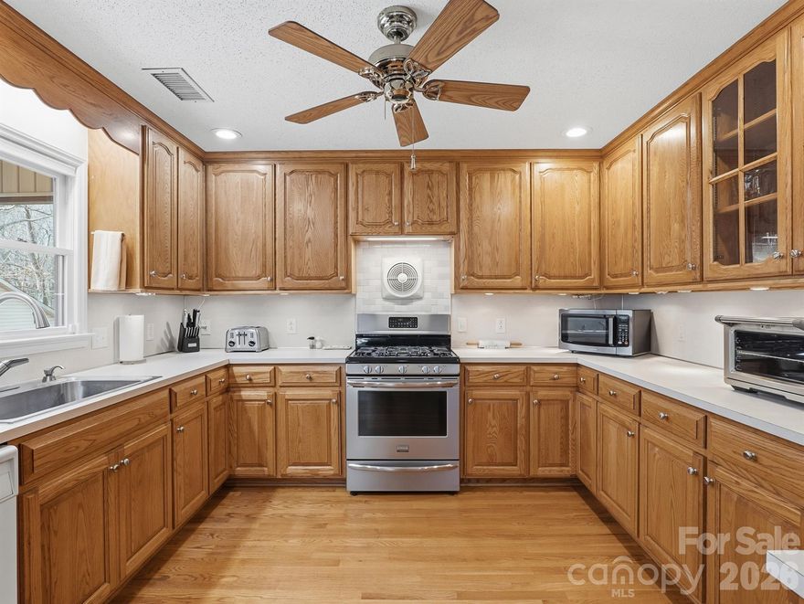 This one-of-a-kind property offers exceptional versatility and stunning surroundings on 9.1 acres (two parcels: 7.98 acres and 1.13 acres). The 2,840-square-foot home features multiple outbuildings and a flexible layout ideal for multi-generational living, rental potential, or private retreat use. Originally a single-level ranch, the home was expanded in 2000 with the addition of a completely new upper level. The residence now includes two separate living areas, each with its own HVAC system. The upper level features a spacious primary suite, 1.5 baths, a full kitchen, and a large living area with a gas fireplace. The lower level offers two bedrooms, two full baths, a full kitchen, living area, bonus room or fourth bedroom, laundry room, and a wood-burning fireplace. Set well back from the road, the home enjoys beautiful, distinctive views from both the front and rear. A detached garage includes two upper bays with a third bay located below, providing ample storage and workspace. The property offers outstanding flexibility for agricultural, development, or commercial use. It includes two wells, with the newer well drilled in 2012. The land is graded and well-drained, and two underground springs located at the rear of the property form the headwaters of Hicks Creek. Conveniently located just off State Park Road, approximately one mile from the entrance to Lake Norman State Park, this exceptional property combines privacy, natural beauty, and prime location. Seller offering buyer $499 home warranty with acceptable offer!