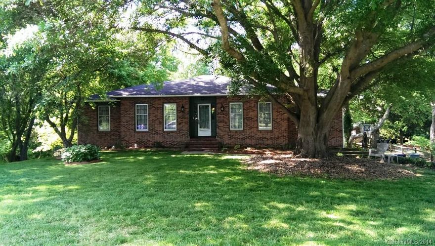 Price Reduced!!!  Bring your Clients!  Beautiful Brick  Home,Established Neighborhood, Great Location, Beautiful Lot , Mature trees. Den, Foyer,Hall and All Bedrooms have Hardwood Floors. Dining Room, Master Bath and Hall Bath have Tile Floors,  Masonry Fireplace/Gas Logs, Freshly Painted Walls,Stainless Steal Appliances,Gas stove 1 yr old, New Refrigerator, New Dishwasher. Spacious Full length Deck on rear of house with patio underneath , Full Basement has Double Garage w/work area for mechanic or carpenter,Family room, Full Bathroom and Finished room that can be used as Bdrm or Office or Workout area. Walking Distance To Elementary School! !.