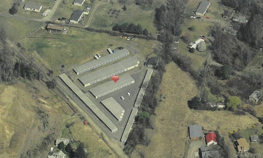 Great income-producing self-storage warehouses on 4 level acres in Greater Asheville area. 275 units occupy 2 acres of this property with room for expansion or vehicle/RV storage. Currently 100% occupied due to convenient location in Swannanoa across from Ingles. City water and sewer to construction office and rental office. Area is convenient to Asheville, Black Mountain and all colleges in the area. Income provided with confidentiality agreement. 9.75% cap rate.