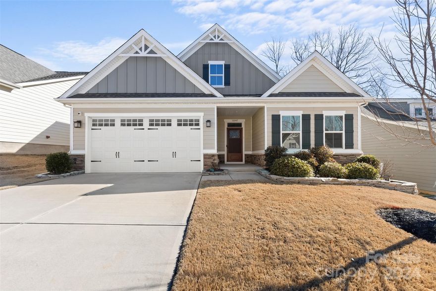 Beautiful 1.5 story residence in sought after Holcomb Woods subdivision, exclusively tailored for those aged 55 and above. The focal point of this home is the open floor plan and kitchen with white cabinets, complemented by a spacious island and quartz countertops. Attributes include hardwood floors, gas fireplace, and a large primary bedroom on the main floor.  Upstairs is a sizable loft along with additional bedroom and bathroom for all the privacy one could want. Embracing comfort and relaxation, the residence features a screened-in porch, a fenced backyard and a two-car garage. Community amenities include swimming pool, welcoming clubhouse, well-lit streets, sidewalks, and hassle-free lawn maintenance provided by the Homeowner Association. Conveniently located mere minutes from supermarkets, dining venues, numerous medical facilities, and Interstate 485, this residence epitomizes convenient living. Don't miss the chance to explore this remarkable home!