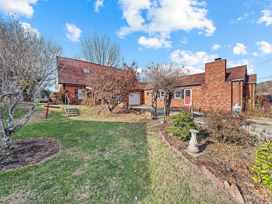 This beautiful brick ranch-style home is in the quaint town of Canton in a very lovely
neighborhood. The home boasts a conveniently attached apartment with a separate entrance that
could easily be converted into an income-producing rental. The open main-level floor plan
offers a cozy living room with an inviting fireplace, a separate family room, and three
bedrooms. You will enjoy a gorgeous mountain view from this property conveniently located only
16 minutes to Waynesville and 25 minutes from Asheville. This one is a must-see with tons of
potential.