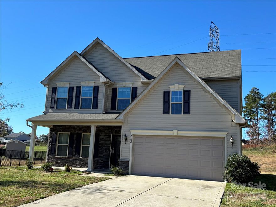 Welcome this spacious and well thought out floorplan. Six bedrooms! Main level primary suite; along with a second bedroom and another full bath on the first floor. Four bedrooms upstairs and two full bathrooms. Fourth bedroom is HUGE and can be used as a combination entertainment room/home office. Laundry is conveniently located on the first floor, near the primary bedroom. Kitchen features an over-sized island and opens to the dining area and spacious family room. Brand new carpet and paint throughout the home. Great for entertaining and connecting with family and friends. Unheated walk-in attic space is wired and super roomy. It is currently being used for storage, but could converted to extra living space. Located close to the Sun Valley Entertainment District, tons of stores and restaurants.