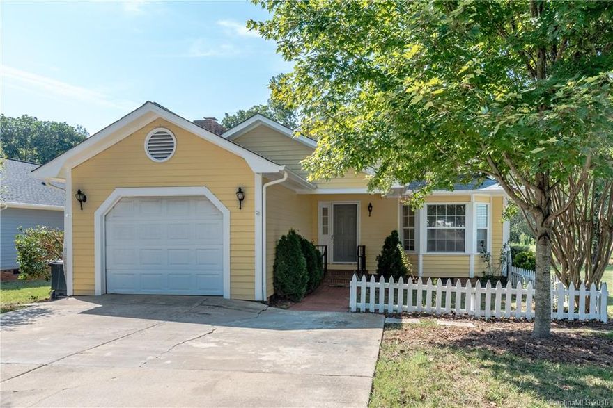 Come to Mulberry Village in Fort Mill! Cozy 2 bedroom 2.5 bath condo with a one care garage easily convertible that can add a 3rd bedroom with over 300 sq. feet of additional living space. The home has just been painted, new carpet installed, and deck off kitchen has been rebuilt. Home needs a little interior TLC. Great privacy as home backs up to trees and natural greenery.