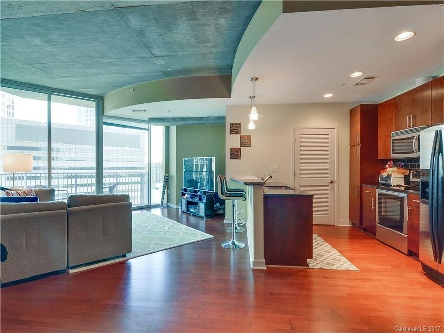 Great unit in the center of it all with active lease permit!  The "03" is the largest 1 bedroom floor plan in the building so do not miss this one.  Unit overlooks the pool and boasts the stunning 23rd level views of Uptown!  Hardwood floors  and tiled bath.  Granite in kitchen with bar height counter.  HOA includes Internet service as well!  Amenities galore including a 24 hour concierge, swimming pool, fitness center, modern lobby, billiards, movie theater room, and club room as well.