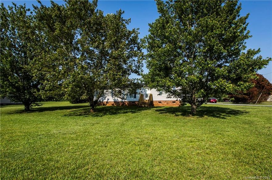 6086 Oakridge Rd., Clover, SC 29710: FHA Qualifiable! This Very Well Maintained Doublewide is offered w/2 Acres, Huge Carport, Lg. Storage Building, New Front Porch and Spacious Patio for Outdoor entertaining. Clean as a whistle, this Open Floor Plan has 3 BR, 2 Full BA, & Spacious Eat-in Kitchen w/Formal Dining.  This is an Ideal location being minutes from Hwy 49 in Lake Wylie.