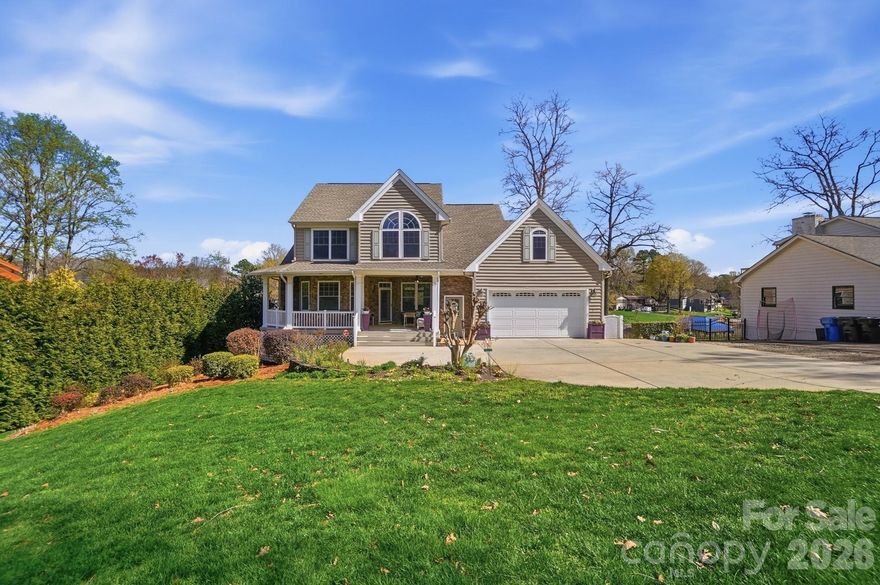 Rare opportunity to own a premier waterfront home on Lake Norman in the heart of Mooresville. Ideally positioned on a wide cove with deep, year-round water, this property offers the perfect balance of protected shoreline, quick big-water access, and beautiful views. With over 4,200 square feet, the home is designed for both comfortable everyday living and effortless entertaining.
A massive rear deck spans the back of the home, creating an exceptional outdoor living space for morning coffee, afternoons watching boating activity, or relaxing evenings overlooking the water. Enjoy peaceful lakefront sunrises from the back deck and stunning sunset views from the inviting front porch. The multi-tiered covered dock with seating area is ready for enjoying the Lake Norman lifestyle.
Inside, the flexible floor plan features two fully functional living areas. The finished basement includes complete second living quarters with its own full kitchen, laundry, and living spaces—ideal for multi-generational living, extended guests, or excellent short-term rental potential. The main level offers a spacious primary suite with large windows capturing morning sunshine and lake views, while upstairs features two additional bedrooms and a large bonus room. Washers and dryers in both the main-level and basement laundry rooms convey.
The septic system is located entirely in the front yard, preserving a generous flat backyard with ample room for a future pool overlooking the lake. This home has been meticulously maintained since construction, with the septic system and HVAC units professionally serviced twice per year. The windows carry a lifetime warranty, offering added long-term value and peace of mind.
Recent updates include a new roof in 2017, upstairs HVAC replacement in 2019, and basement HVAC installed in 2016. Not subject to HOA restrictions, with abundant parking and a prime location just minutes from shopping, dining, and everything Mooresville has to offer, this property presents a rare blend of lake lifestyle, flexibility, and strong short-term rental investment potential.