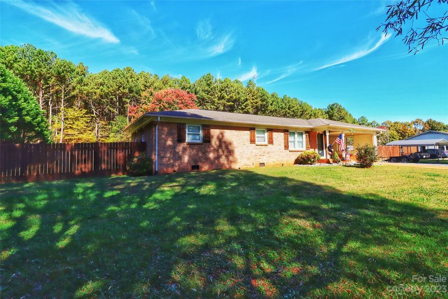 Step into the warm embrace of this charming three-bedroom ranch home, where comfort meets outdoor paradise. Located on a generous lot with a large fenced backyard, this property offers a haven for relaxation and entertaining. Outdoor Delight: The highlight of this home is the expansive patio featuring a grand outdoor fireplace and an inviting inground pool. This inviting space is perfect for entertaining family and friends, creating cherished moments in your own outdoor oasis. Parking Convenience: With multiple options for parking, you'll have ample space for your vehicles and more. This includes a one-car detached garage and a convenient attached carport. This home strikes the perfect balance between comfort and outdoor living, making it an ideal choice for those who appreciate both relaxation and entertainment. Don't miss the opportunity to make this remarkable property your own. Discover the endless possibilities of this welcoming ranch home.