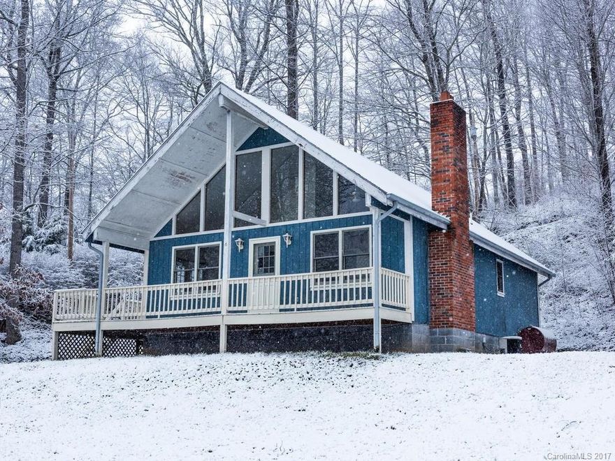 MULTIPLE OFFERS - HIGHEST & BEST OFFERS DUE BY 5PM MONDAY MARCH 20.  Relax in your mountain retreat! Open floor plan, cathedral ceiling, wood burning fireplace, bonus room, hardwood floors, spacious loft, rocking chair covered front porch. Well maintained access road. Less than 10 minutes to I-26. Convenient drive to Asheville and close to Burnsville and Mars Hill.