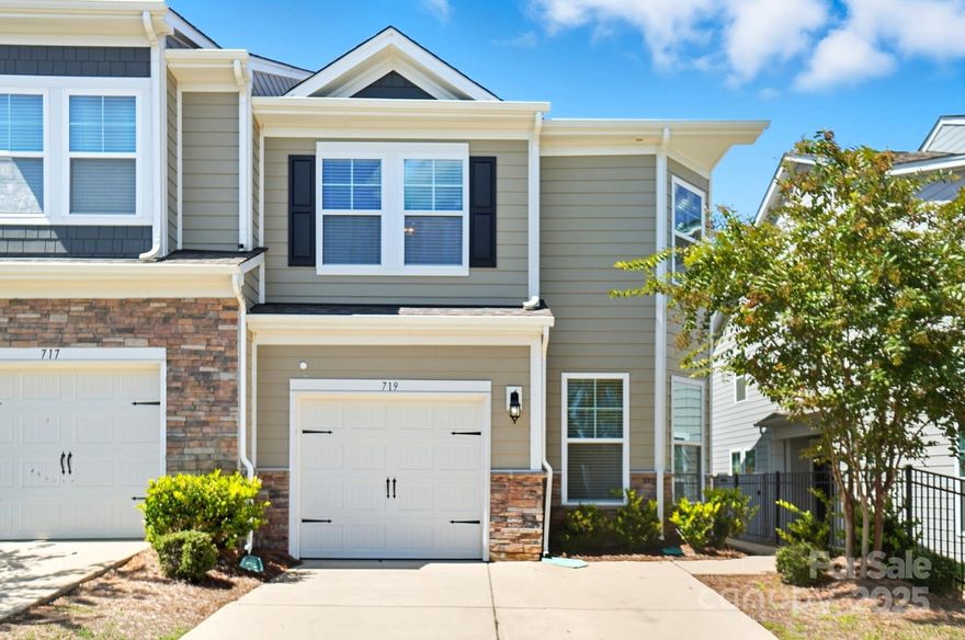 This stunning end-unit townhome offers the perfect blend of style, convenience, & community living just minutes from beautiful Lake Wylie. Step into 1,860 sq ft of beautifully maintained living space featuring brand new LVP flooring throughout both levels. The kitchen showcases never-used stainless steel appliances including gas range, microwave, & refrigerator. Even the washer & dryer convey and are brand new and ready for your first load! Three comfortable bdrms & 2.5 baths provide ample space for living, while the designated office & bonus loft offer endless possibilities. Enjoy the privacy & convenience of your own driveway with parking for two cars, plus additional natural light from windows on three sides. Full yard maintenance is included, so you can spend your weekends enjoying the exceptional community amenities: resort-style pool, shaded picnic spots, elegant clubhouse, playground & bocce ball court. The private backyard is surrounded by mature trees, offering a serene, wooded backdrop with no rear neighbors for ultimate privacy & tranquility. With award-winning schools, this home offers both excellent education & proximity to Lake Wylie's recreational opportunities. Ready for immediate move-in—your new chapter starts here!