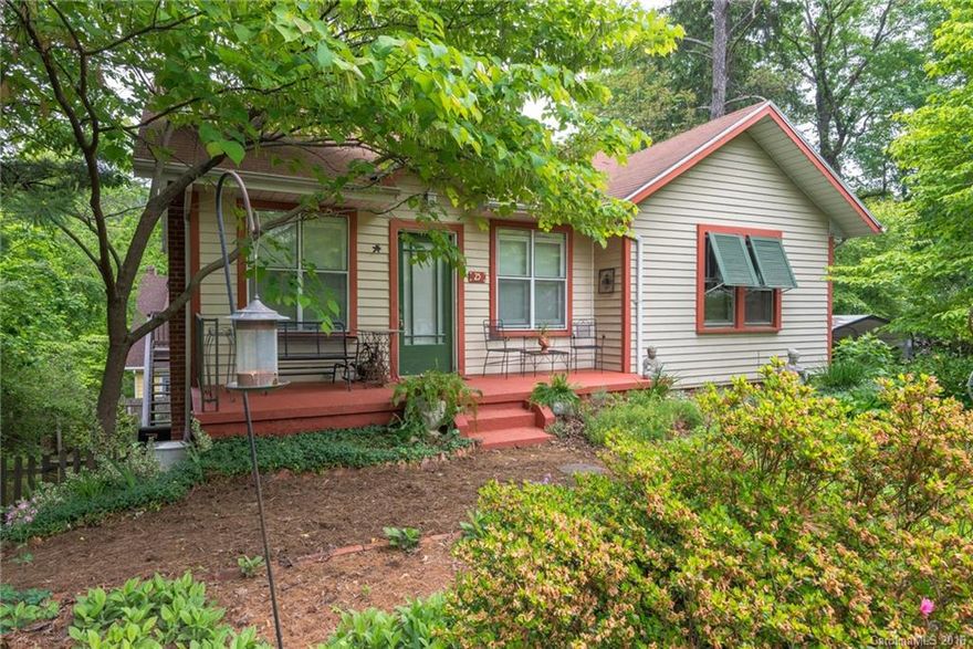 Be prepared to fall in Love with this charming home, minutes from Biltmore Village. This Craftsman home has nine foot ceilings, original solid oak floors, warm nat gas heat and Jutol gas fireplace. Gas stove rocks the kitchen, built-in shelves and drawers in bedroom. The List of Very Important Things that Dad will ask about: Storm windows, super low utilities, updated furnace, electrical, plumbing and sewer line. Doggie door to fenced back yard. Life is good here, come take a look!