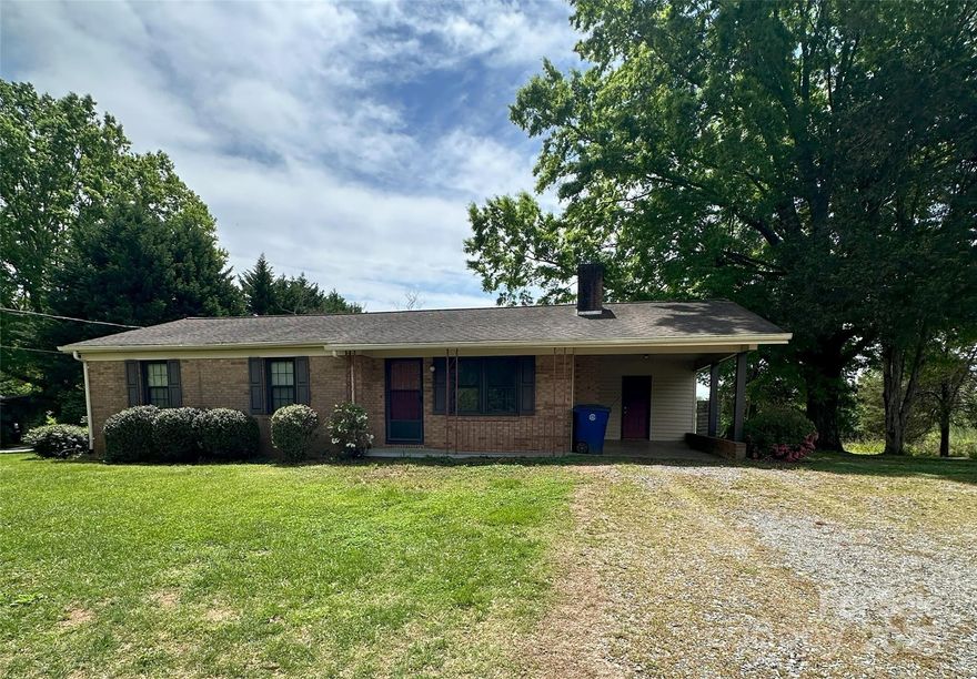 Brick ranch with storage shed and 2-story outbuilding with electricity would make a great workshop, storage area or playhouse with a deck. Large patio area for entertaining located off kitchen. Well on property but connected to city water. Double sinks in full bath, 3 bedrooms. Dining Room has storage closet. Laundry/utility room off carport. Lots of room for garden on .48 acre lot. Located near Hwy 16 and Conover shopping off Emanuel Church Rd.