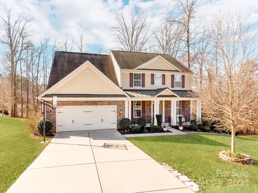 Welcome to this Exceptional Lake Wylie School District Home which rests on a Large Private Lot with Seasonal views of the Water! This very well-maintained home has a Large Master-Suite on the main floor overlooking the Private fenced-in back yard. The home provides an overall Open-and-airy concept with Large Windows in the 2-Story Great Room and 2-Story Foyer, along with Large Bedrooms and Bonus-Room upstairs! Many details to list including Coffered Ceilings in the Dining, Trey ceiling in Master-Suite, heavy trim and crown molding throughout, Granite countertops, tile backsplash, Stainless Steel appliances, and a massive breakfast bar in the Chefs Kitchen catering to those large families. Enjoy your summer BBQ's on the covered back patio that expands out onto the deck overlooking the lush trees and private backyard. The Beautifully done backyard includes Custom Stone Firepit & Horseshoe Pits. Enjoy the community kayak and/or Canoe Launch site to explore the beautiful Lake Wylie!