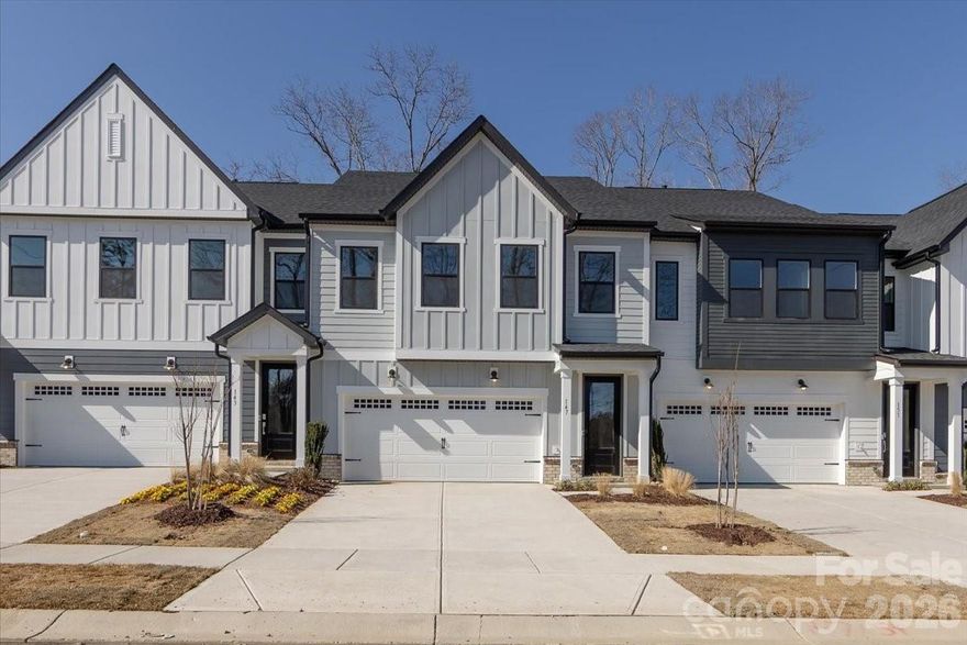 Life at Camryn at Southbridge is designed to feel easy, connected, and elevated, and the Knight plan at 147 Landy St brings that vision to life. As the larger of the two plans in the community, this home offers space to settle in and room to grow, all within minutes of downtown Fort Mill and convenient access to I-77. Community walking trails and a neighborhood playground create a welcoming, everyday rhythm, paired with access to highly regarded schools. Inside, thoughtful details shape how the home lives. A front-load two-bay garage with a full-length driveway opens to a convenient drop zone that keeps daily routines organized. Oak box stairs and a trim-accented ceiling in the foyer set a warm, polished tone from the start. The kitchen anchors the main living area with warm brown cabinetry, a GE 30-inch free-standing gas range, and a large sink with a Delta Essa touch faucet, making it a natural gathering place. Step outside to an extended 8' x 8' patio overlooking wooded views, perfect for quiet mornings or relaxed evenings. Upstairs, a loft adds flexible living space, while the primary suite features a tiled shower with tile floor pan and the secondary bath includes tiled walls above the tub, completing a home designed for comfort, function, and everyday enjoyment.