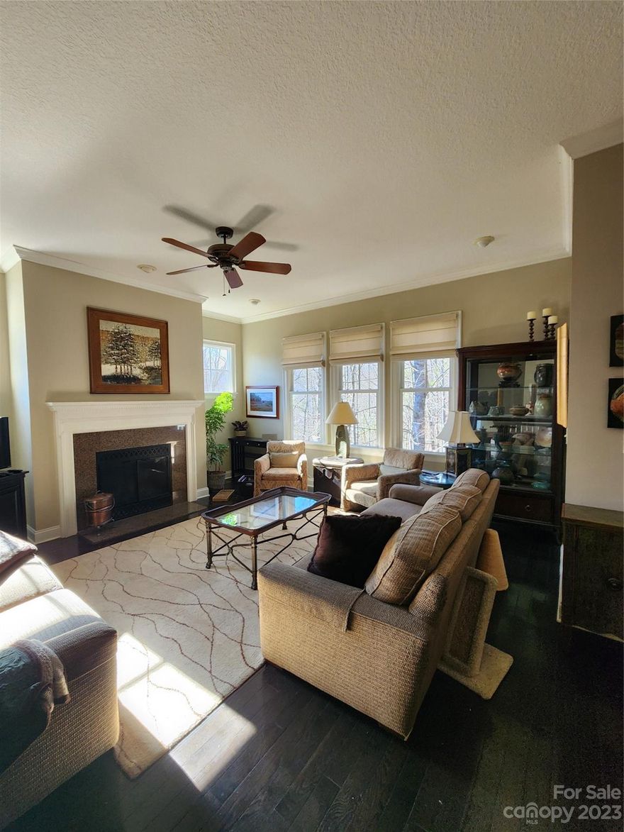 Spacious and elegant living awaits you in Southcliff. Convenient to all Asheville has to offer, this gated neighborhood offers a sense of seclusion plus more than 6 miles of managed trails rising from 2500' elevation to the summit at 3900'. This home offers everything you need for one level living plus either one or two large bedrooms and den in the daylight basement. No detail was overlooked when this home was completed in 2008 with 9 foot ceilings and crown moulding, nearly every window offers a tree house view toward acres of Southcliff common area and direct access to the trail system. Crawl space professionally encapsulated in 2023.