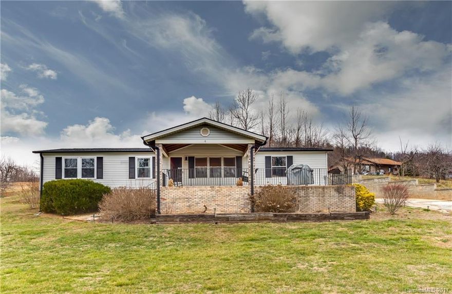 Beautiful quiet country feel to this 3BR/2BA updated home with large covered front porch on just over 3 acres in Edneyville.  Immaculately maintained home has open floor plan, with breakfast bar and fireplace. Large master suite with walk-in closet and gorgeous master bath.  2 storage buildings stay.  Large lot for animals, garage or room for family to play.  Great location and still convenient to town. Nice level acreage hard to find, don't miss out!