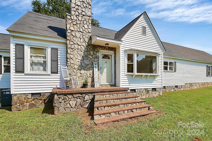 One Level home on corner lot with over 3 acres.  Additional metal building in back is 20' x 26' and has power, a garage door, concrete foundation, and is great for storage.  Two heat pumps.  3 bay garage!  Portion of 3 bay garage has heating and cooling unit.  (Not counted toward heated living area)  Much of the parcel is pasture area and already fenced in.  Huge sunroom with windows all around.  Galley style kitchen is oversized, has beautiful cabinetry, stainless appliances, bar seating, and storage for everything! Wood floors.  Fireplace with logs but they are not currently connected to a propane tank.  Owner's suite has the laundry and separate tub and shower.  Enjoy the rest of your summer on the patio under the massive back yard shade tree.  Per seller: Property has septic system with 1000 gal tank that was pumped 2 years ago.  Per Lincoln County: No Septic Permits on record.