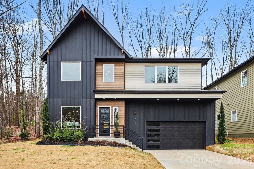 This contemporary home offers open-concept living and plenty of space in a great south Charlotte location!
The gourmet kitchen is the heart of the home, featuring an oversized waterfall island and seamless flow into the family room and dining area. Whether hosting friends or enjoying a quiet night in, the layout feels intentional and inviting. A private main-level office provides an ideal work-from-home setup, thoughtfully tucked away from the main living areas. Upstairs, you’ll find the spacious primary bedroom, stunning bathroom with oversized shower and soaking tub, plus 3 more bedrooms and two full baths. The laundry room is also located upstairs, complemented by generous storage throughout. Step outside to enjoy the covered back patio, a perfect extension of the living space for morning coffee, evening dinners, or relaxed weekends at home. Impeccable finishes and carefully selected fixtures carry throughout, blending contemporary style with warm, livable design.