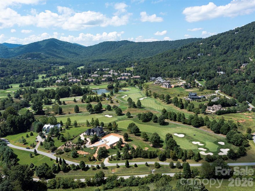 Nestled just off the sixth green in the prestigious Cliffs at Walnut Cove, this prime .93-acre homesite offers a rare opportunity to bypass the years of planning and dive straight into the mountain lifestyle.  Once of the few remaining golf course lots, this property is perfectly positioned near the lush fields of Creekside Farm and within easy reach of both the clubhouse and the main gate, this lot combines golf-course proximity with effortless neighborhood navigation. This offering is made even more compelling by the inclusion of meticulously crafted plans for a custom "Mountain Modern Cedar" home, specifically designed to harmonize with this site's unique topography and take full advantage of the surrounding views.

The proposed residence - not included in the price - embodies contemporary luxury, featuring an expansive main-level living area that flows seamlessly through a grand foyer into a vaulted great room. The heart of the home is a chef’s kitchen equipped with a large central island and a walk-in pantry, while the adjacent "Gallery" provides a sophisticated transition to the private quarters. Retreat to the owner’s suite, a sanctuary of comfort featuring dual walk-in closets and a spa-inspired bath. For those working from home, a dedicated study with elegant sliding doors offers a quiet professional retreat. The design is perfected for entertaining with a massive 512-square-foot lanai—complete with an outdoor fireplace and optional kitchen—extending the living space into the fresh mountain air. 

Living in The Cliffs at Walnut Cove is an invitation to a world-class lifestyle. With a Cliffs membership, you gain access to a state-of-the-art 18,000-square-foot wellness center, indoor and outdoor pools, tennis courts, and a full-service luxury spa. Golf enthusiasts will find no better home than one bordering a Jack Nicklaus Signature course, while social life centers around "The Tavern" and the award-winning clubhouse. Bordering the Pisgah National Forest and located just minutes from the Blue Ridge Parkway, this property offers a peaceful, high-altitude sanctuary only a short drive from the culinary, cultural, and artistic vibrancy of downtown Asheville. This is more than just a piece of land; it is the blueprint for your future in the Blue Ridge Mountains.

Note:  This offering is for the lot and the home plans - not construction of the home.