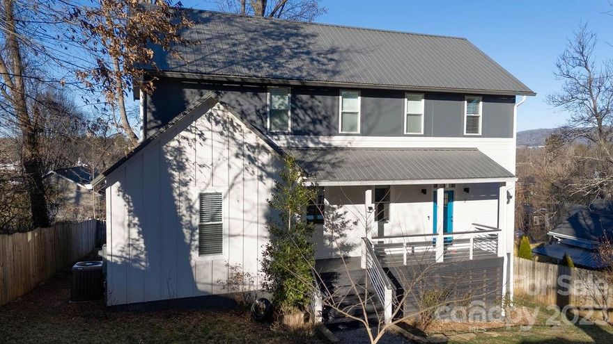 Beautiful and bright contemporary home in the heart of West Asheville! This home is full of modern custom finishes making for easy living. Open concept living area features gas fireplace, 9' ceilings, chef's kitchen with huge quartz island and energy star appliances including gas range. Primary bedroom has access to covered back deck with views of downtown! Check out the relaxing ensuite bathroom with shower room and stand-alone tub and double vanity. Additional main level bedroom has so many possibilities. On the upper level, you'll find two more bedrooms, a full bathroom and another living space to use for work or play. You'll never run out of storage space with ample walk in closets and a huge crawl space. The home is fully fenced with garden plots for flowers or vegetables. You'll enjoy the gentle fragrance of English roses blooming in the spring on your covered back deck. Home also features a 240V Electric Vehicle charging station and Google Nest smoke alarms.