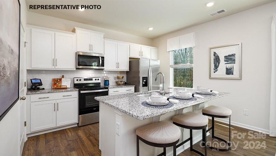 MOVE-IN October. The Penwell is a gorgeous, 2-story home that boasts 4 bedrooms, 2.5 bathrooms, & 2-car garage. Upon entering the home, you will be greeted with a dedicated office with French doors. The kitchen is open to the great room which is great perfect for entertaining. Enjoy your beautiful kitchen with stainless steel appliances, granite countertops, white cabinets, subway tile backsplash, walk-in pantry and spacious island. Upstairs you will find the large primary suite with walk-in closet, spacious secondary bedrooms with hall full bath, and laundry room. Community offers pool, cabana, bocce ball, playground and walking trails in sought after location, close to Rock Hill and Fort Mill conveniences. REPRESENTATIVE PHOTOS