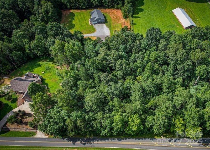 Price Reduced!! NO HOA -Modular allowed on this .85 Level lot #8, just minutes from Lake Rhodhiss-Located at the foothills of the Blue Ridge Mountains in North Carolina. Close to public lake access, downtown Morganton, Hickory, Lenoir, and I-40.  NO CITY TAXES! Seller offering seller financing call for details. Some restrictions-Min Sq ft. Livestock. Call today do not miss out on this opportunity to own your own land.  Don't wait see this lot today-OWNER FINANCING AVAILABLE!!