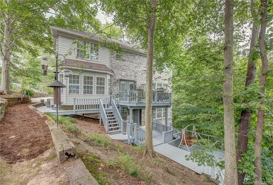 Beautiful home in desirable Timberlake! Home feels like a treehouse retreat with view of the water. Basement is spacious and has access to walk out to the boardwalk. Setting is unmatched! 2 story entry, great room open to dining. Kitchen with granite counters and breakfast area overlooking deck, perfect for entertaining. Master bedroom is flooded with light, so many windows! Separate tub shower. Close to downtown Belmont and Cramerton, both are golf cart towns!