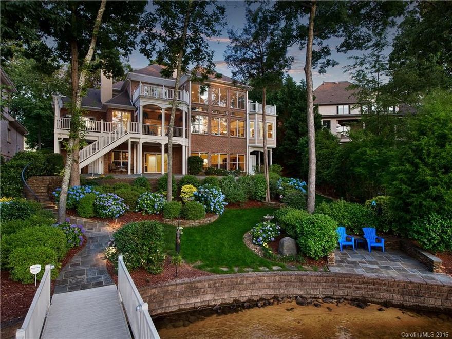 No detail has been spared in this waterfront home in The Peninsula on Lake Norman. Nestled in a cul-de-sac & quiet cove w/private dock, outdoor shower & miles of views, its centerpiece is the huge gourmet kitchen w/4x6 island and 6-burner commercial range.  Main floor office; master suite has warming fireplace & recently updated bath. Enjoy outdoor living on the screened porch, terrace or balconies. Lake level includes man cave, wine cellar & guest room. Walk in attic, abundant storage. Love it!