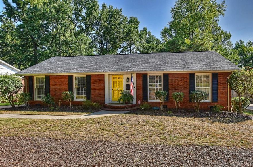 Updated all brick ranch home. Situated on large lot, tree lined & rear yard fenced. Kitchen updated in 2010 with new cabinets, granite counters and recessed lighting. Amazing use of space! Bathrooms updated! Hardwood flooring throughout.  Wonderful natural light with floor to ceiling windows. Great outdoor space with large deck and shed with electricity.