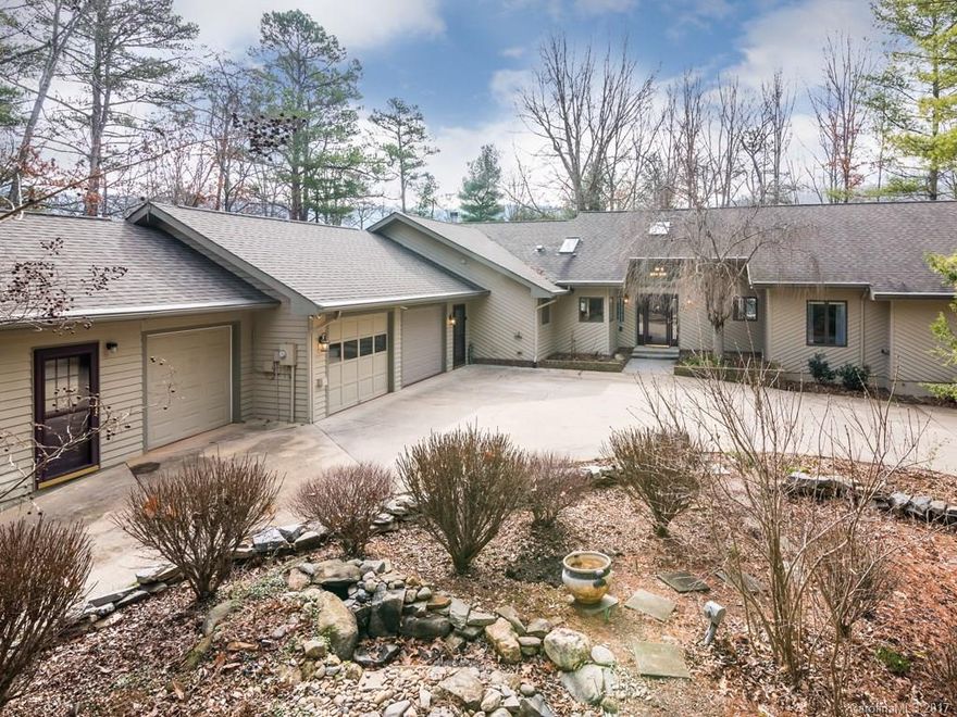 Spacious one level home w/ loft in desirable Reems Creek. Great floor plan w/ open kitchen, living & dining area w/ 48" wood burning fireplace. Lots of natural light from 8 skylights. Private level lot @ end of cul-de-sac.  Large back deck for grilling and entertaining. 2 sunrooms, separate office/studio. Heated 2 car garage. Plenty of storage space.