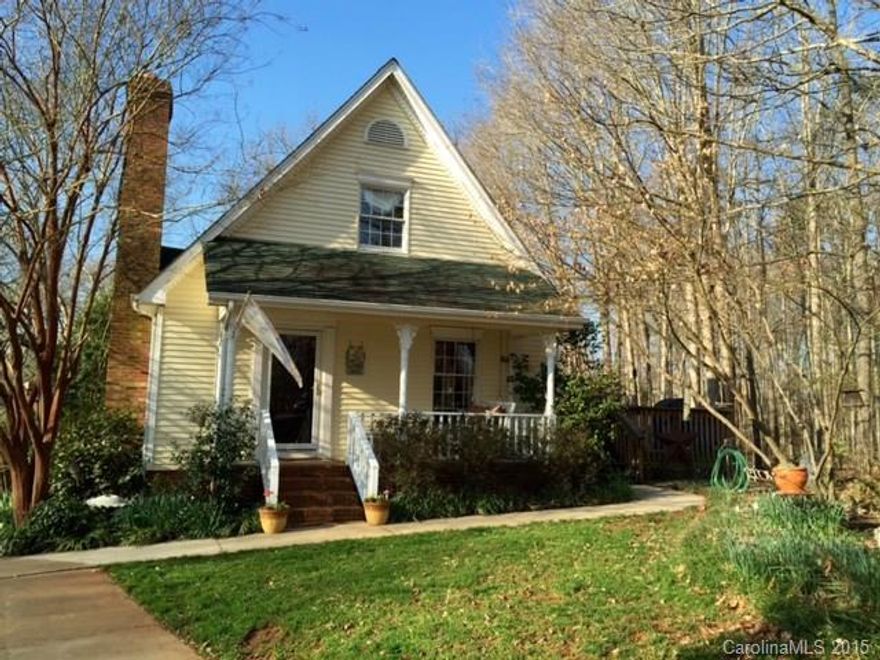 Truly charming home! Kitchen has custom cabinets, stainless appliances & granite countertops. Master bath has been updated.  Master bedroom has private access to large deck.  Gas fireplace in living room & fireplace in basement.  Small workshop w/garage door in basement.  Tons of storage throughout house.  Beautiful wooded lot. Heated/cooled detached workshop w/garage door & covered porch. Quiet neighborhood with large lots. Enjoy spending time on the large deck or swinging on the front porch!